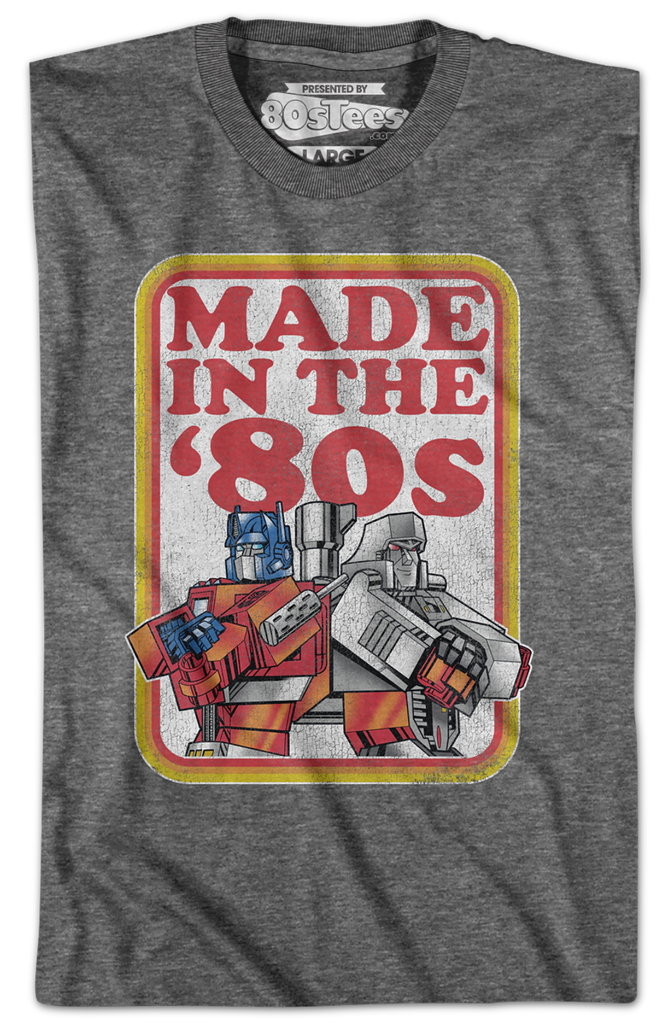 http://www.80stees.com/cdn/shop/files/optimus-prime-and-megatron-made-in-the-80s-transformers-t-shirt.folded_1024x1024.png?v=1700875807