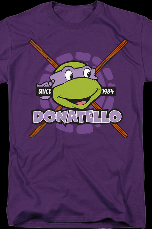https://www.80stees.com/cdn/shop/products/purple-donatello-since-1984-teenage-mutant-ninja-turtles-t-shirt.master_500x750_crop_center.jpg?v=1700696395